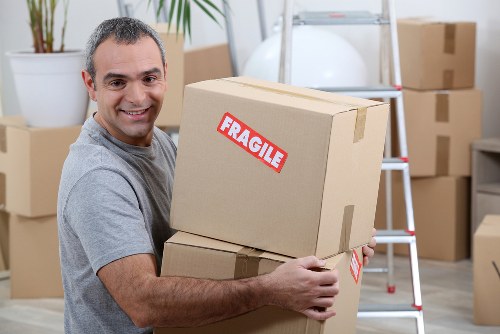 Mover loading furniture safely for a Roehampton man and van service