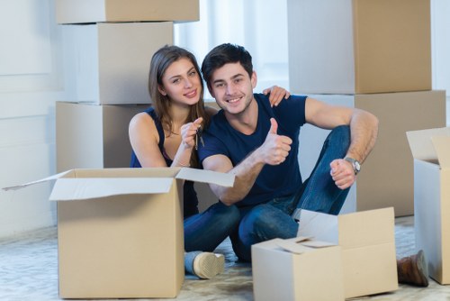 Professional movers loading furniture for a relocation in Roehampton
