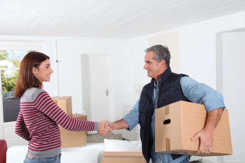 Business relocation team handling office furniture and equipment in Roehampton