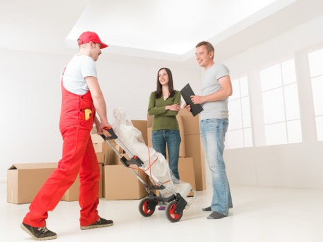 Packed boxes and moving equipment ready for a house move