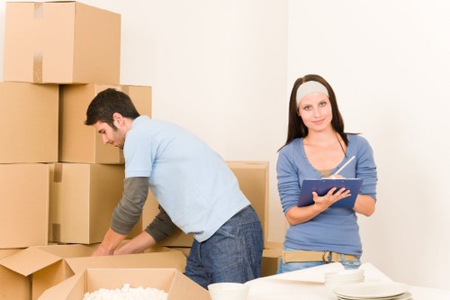 Careful wrapping of fragile items during packing services in Roehampton