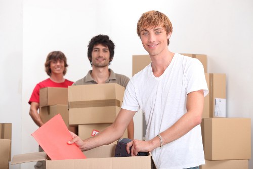 Workers handling furniture carefully during a removal job